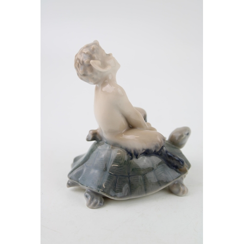 81 - Royal Copenhagen faun riding on tortoise going fast 858, height 9cm.