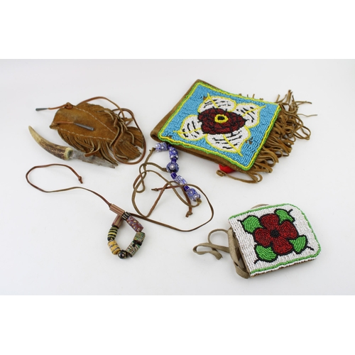 293 - Three items of North American Indian suede leather and beadwork including two pouches and a knife sh... 