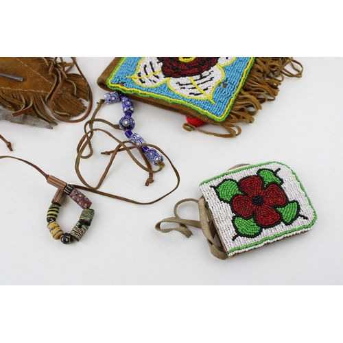 293 - Three items of North American Indian suede leather and beadwork including two pouches and a knife sh... 