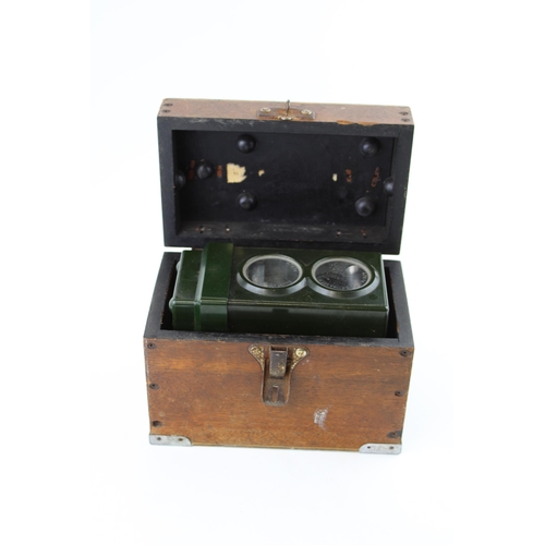 294 - An early c20th Skymaster Ghost high speed pigeon timing clock in bakelite in the original wooden box