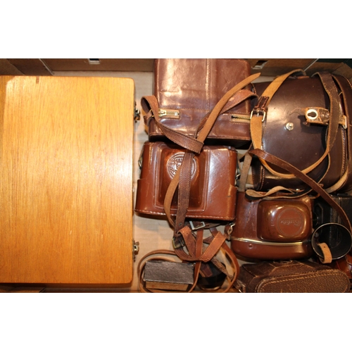 303 - A collection of vintage camera equipment and a pair of binoculars by Ross '9x35 Stepruva'. Camera eq... 