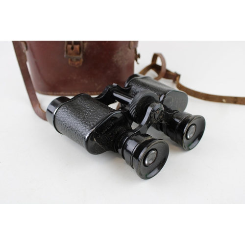 305 - A pair of vintage Le touquet 8x25 binoculars in original case