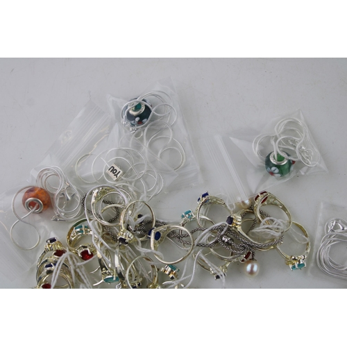 310 - A collection of costume jewellery to include rings, necklaces and charms. (Qty)