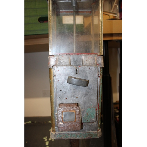 315 - A vintage gumball / sweet dispenser, cast iron base with perspex case sitting in cast aluminium surr... 