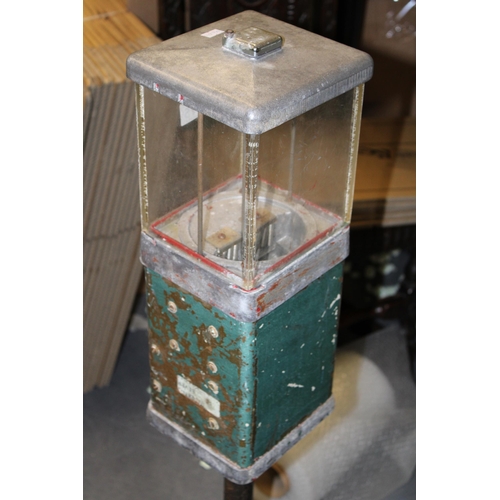 315 - A vintage gumball / sweet dispenser, cast iron base with perspex case sitting in cast aluminium surr... 