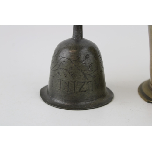 321 - A collection of metalware items to include a 19th cast iron door stop in the form of a sight hound t... 