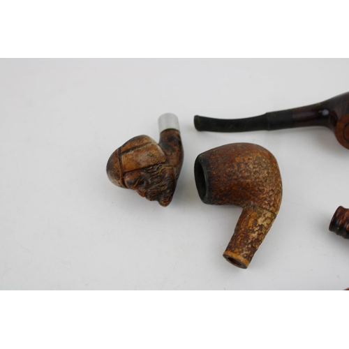 324 - A collection of briar and hand carved tobacco pipes together with a Waltham full hunter pocket watch... 