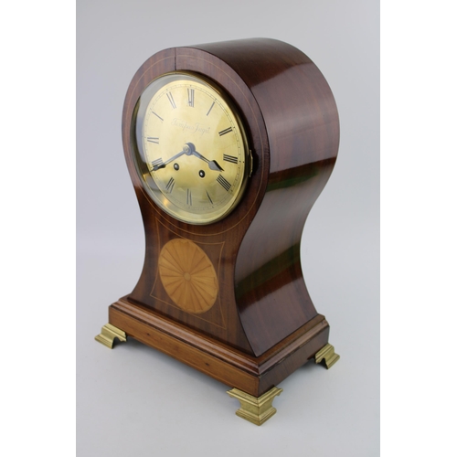 327 - A French Edwardian inlaid mahogany balloon mantle clock, Brass dial with Roman numeral hour markers.... 