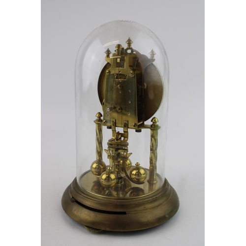 330 - An anniversary clock with brass base and glass dome.  Dial decorated with signs of the zodiac.  Heig... 