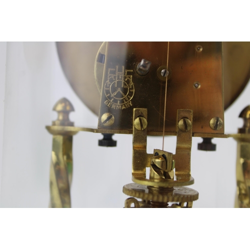 330 - An anniversary clock with brass base and glass dome.  Dial decorated with signs of the zodiac.  Heig... 