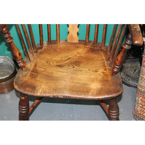 339 - A yew and elm Windsor chair. Height 90cm width 60cm.