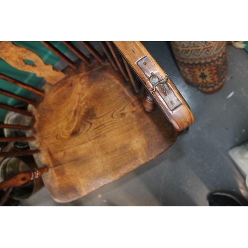 339 - A yew and elm Windsor chair. Height 90cm width 60cm.