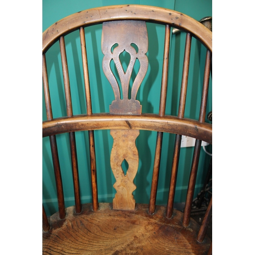 339 - A yew and elm Windsor chair. Height 90cm width 60cm.