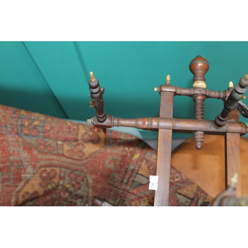 340 - A late 19th / early 20th century spinning wheel with seven spoke wheel and bone finials. Height 59cm... 