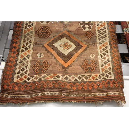 342 - A traditional hand knotted vintage Kilim carpet, natural dyes in browns, oranges and creams. 270cm x... 