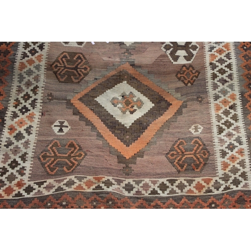 342 - A traditional hand knotted vintage Kilim carpet, natural dyes in browns, oranges and creams. 270cm x... 