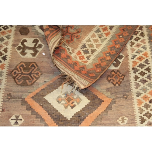 342 - A traditional hand knotted vintage Kilim carpet, natural dyes in browns, oranges and creams. 270cm x... 