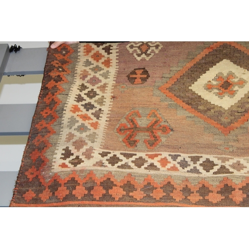 342 - A traditional hand knotted vintage Kilim carpet, natural dyes in browns, oranges and creams. 270cm x... 