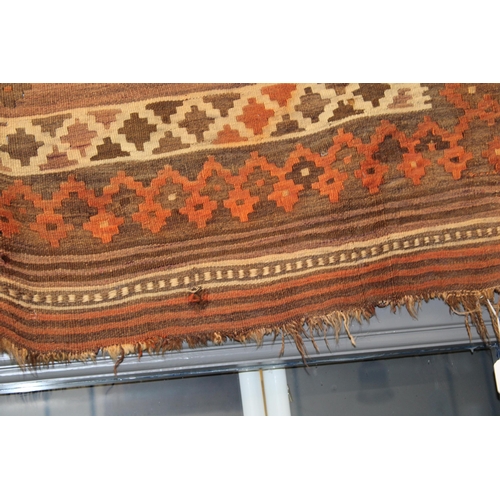 342 - A traditional hand knotted vintage Kilim carpet, natural dyes in browns, oranges and creams. 270cm x... 