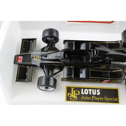 427 - A boxed die cast  Polistil Lotus John Player Special 1/18 scale F1 car. Width 29cm.