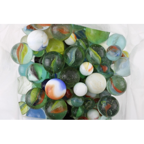 433 - A collection of vintage marbles of varying ages.