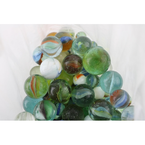 433 - A collection of vintage marbles of varying ages.