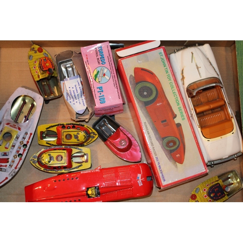 437 - A collection of reproduction vintage style tinplate toys to include a Sunbeam Record Racer, Torpedo ... 