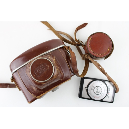 447 - A vintage Zeiss Ikon CONTINA 1a 35mm Camera, Novar 45mm 3.5 in original leather case with Boots KL-7... 