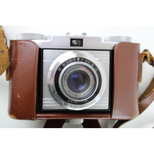 447 - A vintage Zeiss Ikon CONTINA 1a 35mm Camera, Novar 45mm 3.5 in original leather case with Boots KL-7... 