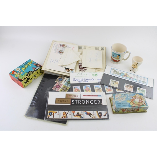 454 - A stamp album with a set of first day cover together with a peter pan viewer, a spoon set and two so... 