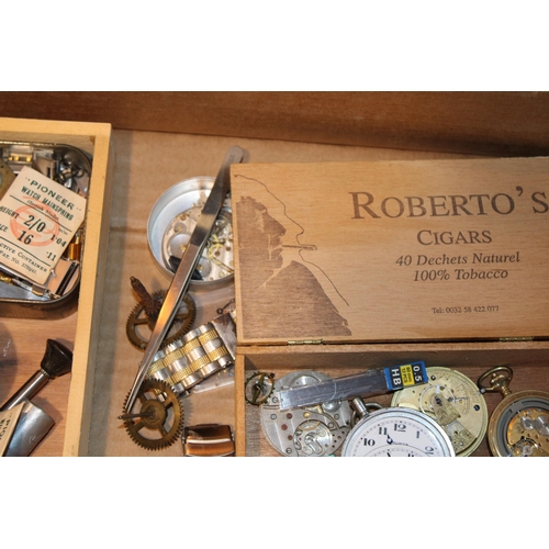 550 - A collection of watchmakers and jewellers tools together with wristwatch and pocket watch parts and ... 