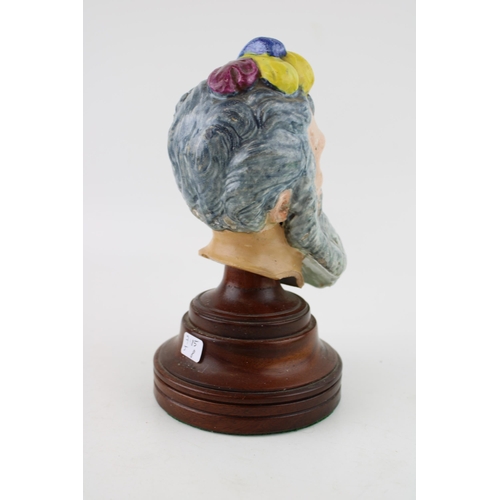 56 - An early 20th century pottery bust of a gentleman, similar to Bacchus, unmarked, wooden plinth, 20.5... 