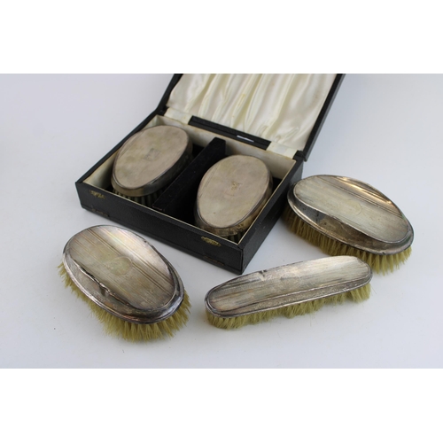 561 - A collection of silver brushes to included a cased example hallmarked Birmingham 1967 (inscribed wit... 