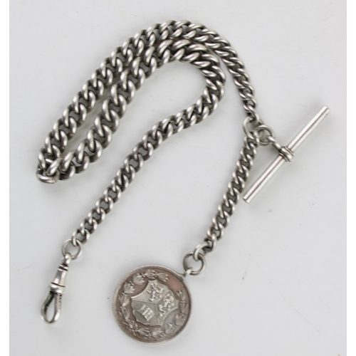 571 - A silver Albert chain, every link hallmarked, silver T bar and silver fob. Length 37.5cm. Weight 56.... 