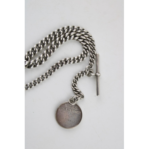 571 - A silver Albert chain, every link hallmarked, silver T bar and silver fob. Length 37.5cm. Weight 56.... 