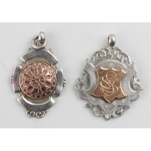 572 - Two silver fobs to include example with rose gold dart board, Birmingham 1947 together with another ... 