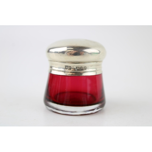 576 - Silver topped cranberry glass pot, 43mm, London 1910, 'N Bs'.