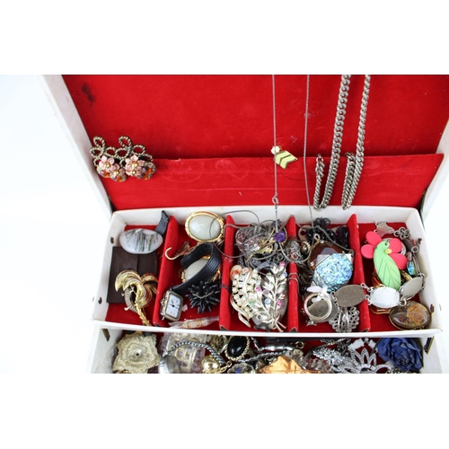 610 - A vintage jewellery box containing a number of vintage costume jelly brooches, necklaces and other s... 