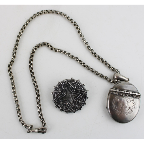 617 - A silver oval locket, beaded decoration, on silver coloured chain, with silver brooch, combined 31.2... 