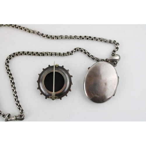 617 - A silver oval locket, beaded decoration, on silver coloured chain, with silver brooch, combined 31.2... 