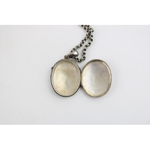 617 - A silver oval locket, beaded decoration, on silver coloured chain, with silver brooch, combined 31.2... 