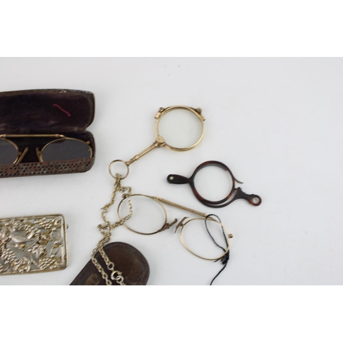 625 - Gold plated lorgnettes, pinz nez glasses, cases etc., leather cased fleam and plated coin holder.