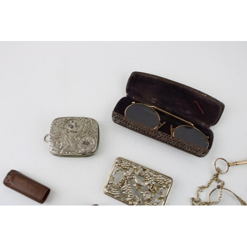 625 - Gold plated lorgnettes, pinz nez glasses, cases etc., leather cased fleam and plated coin holder.