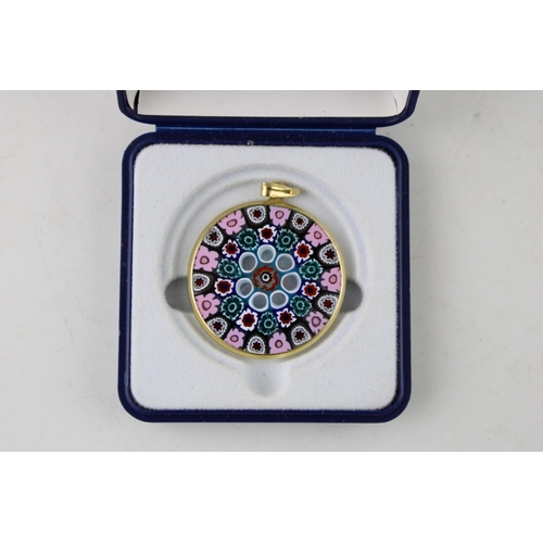 629 - Millefiori glass pendant in yellow coloured metal mount. Diameter 33mm.