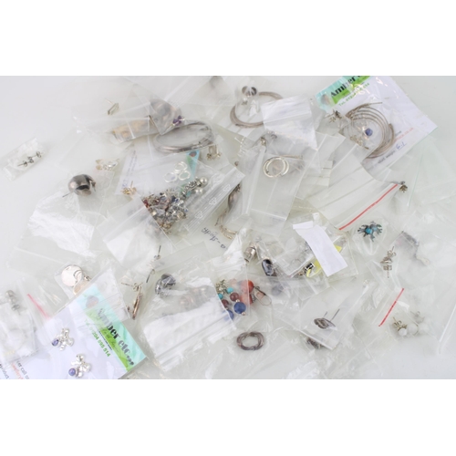 638 - A large collection of circa 90 pairs of sterling silver earrings, some gem set and some with semi pr... 