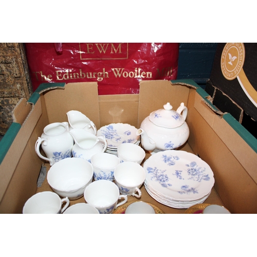 76 - A collection of Coalport tea ware in the 'Divinity Blue' pattern to include tea pot, six trios, two ... 