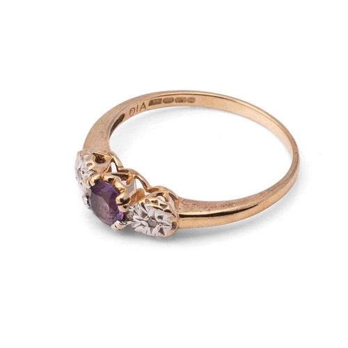 417 - A 9ct gold, diamond and amethyst three stone ring, the central amethyst of approximately 5mm diamete... 