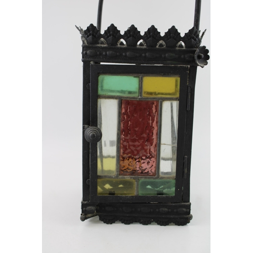 19 - A late 19th / early 20th century porch lantern, pressed steel with cast frame and stained glass pane... 