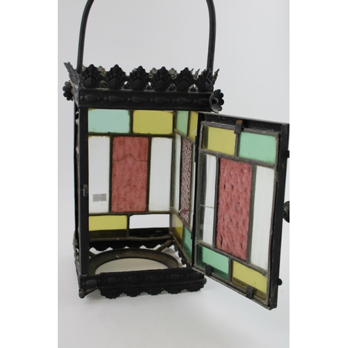 19 - A late 19th / early 20th century porch lantern, pressed steel with cast frame and stained glass pane... 