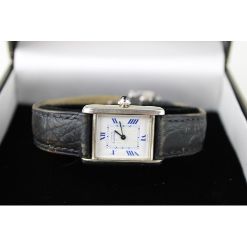 274 - A silver cased Must de Cartier tank wristwatch, the signed dial having insignia pattern to the centr... 